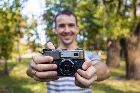 Young Man Holding in Hands Old Vintage Camera Stock Photo - Image of ...