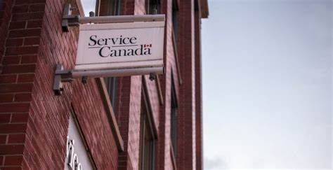 Service Canada logo on their office on College Str. in Toronto, Ontario. Service Canada is a ...