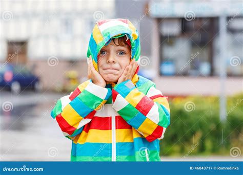 Funny Smiling Little Boy Walking in City through Rain Stock Image ...