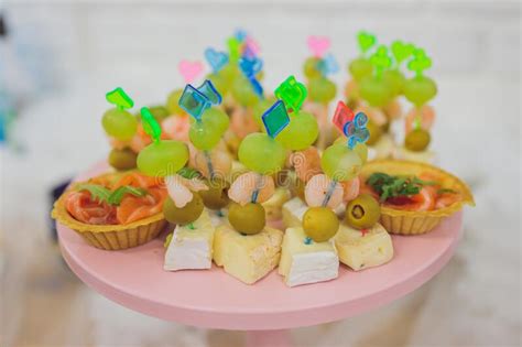 Beautifully Decorated Catering Banquet Table with Different Food Snacks and Appetizers with ...