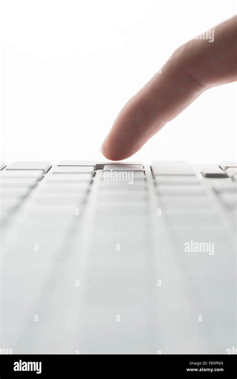 Finger tap the Enter key of a keyboard Stock Photo - Alamy