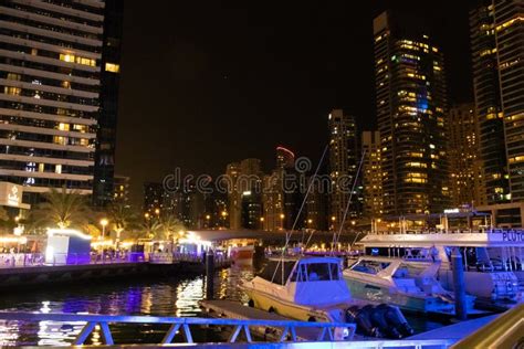 Night View of Dubai Marina Skyscrapers and Luxurious Yachts at Pier UAE Editorial Photo - Image ...