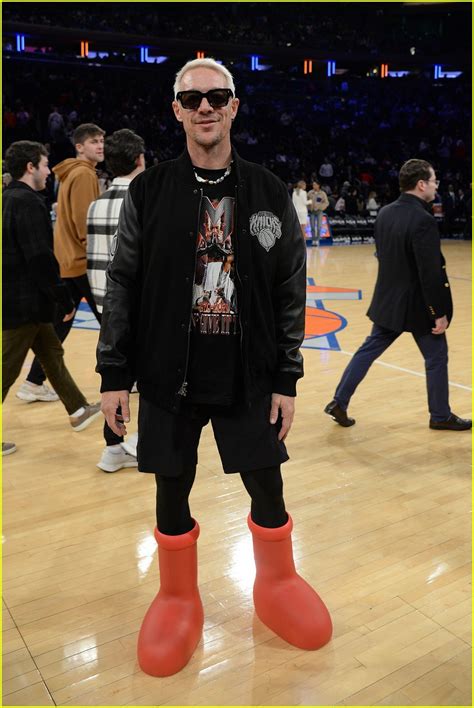 Diplo Wears the Viral Big Red Boots, Matches NFL Star Xavier McKinney at Nets vs. Knicks Game ...