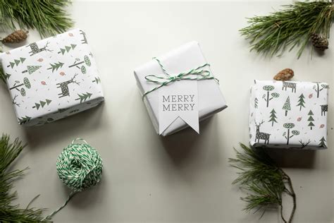 Gift boxes on white table near pine branches · Free Stock Photo