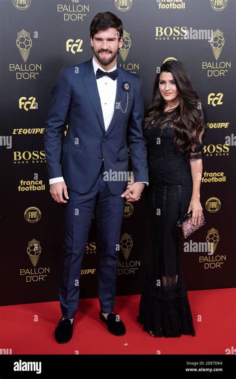 Liverpool goalkeeper Alisson Becker and wife Natalia Loewe arrive to attend the Ballon d Or ...