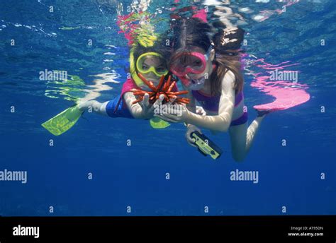 Two young girls snorkeling , Hanauma Bay, Oahu Stock Photo - Alamy