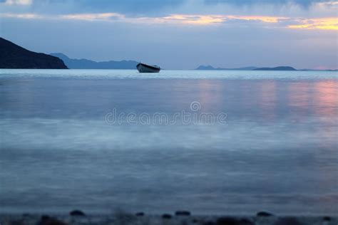 Sunset in the Sea with a Boat. Stock Photo - Image of island, coast ...