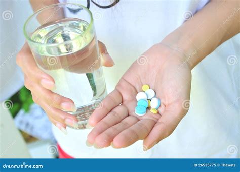 Take Medicine And Water Royalty Free Stock Photo - Image: 26535775