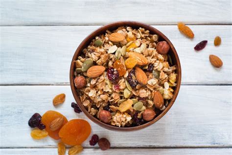 Granola in a wooden bowl. stock image. Image of breakfast - 69051671