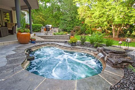 Jacuzzi hot tub pool traditional image ideas with outdoor potted plants rock landscape | Jacuzzi ...