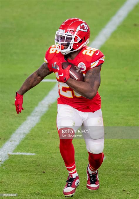 Kansas City Chiefs Running Back Damien Williams runs with the ball... | Kansas city chiefs ...