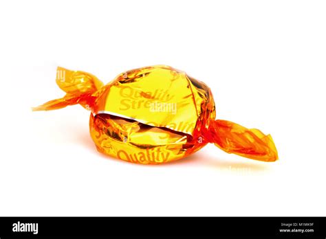 Toffee Penny Quality Street chocolate on a white background Stock Photo - Alamy