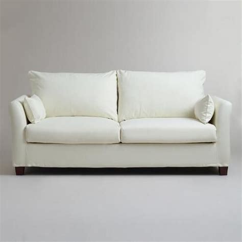 Ivory Luxe Sofa Slipcover | World Market | Slipcovered sofa, Sofa ...