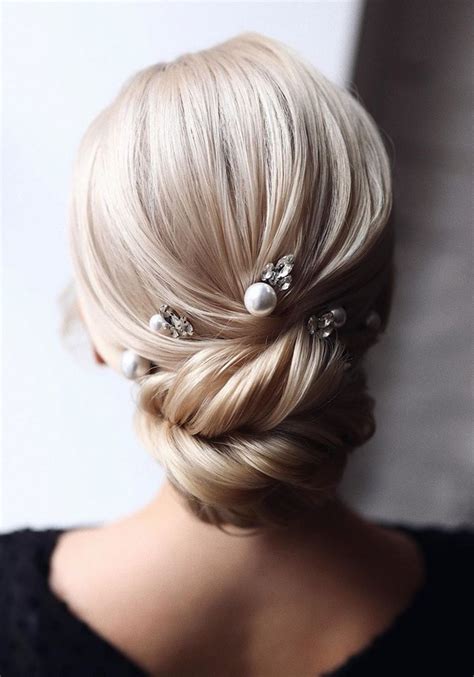 20 Classic Low Bun Wedding Hairstyles from Tonyastylist | Roses & Rings