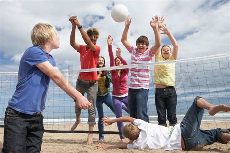 Teenagers playing volleyball | Stock image | Colourbox