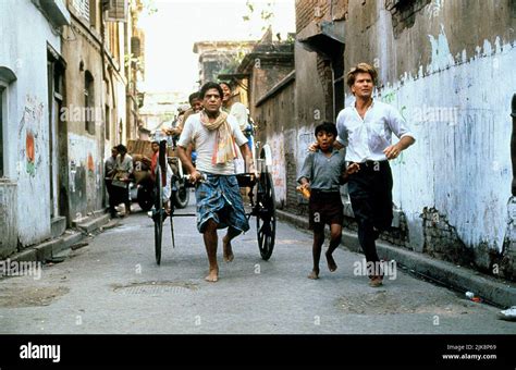 Om Puri & Patrick Swayze Film: City Of Joy (UK/FR 1992) Characters: Hazari Pal & Max Lowe ...