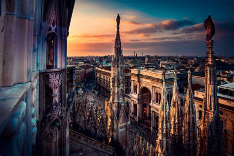 beautiful view at sunset from Duomo cathedral of Milan roof top ...