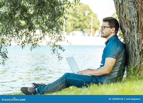 Man with Laptop Sitting Outdoors in Nature Stock Photo - Image of laptop, person: 102098146