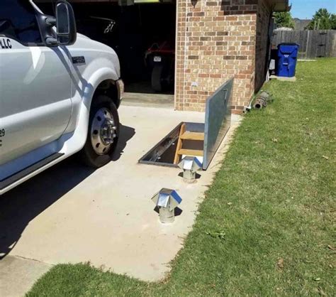 Below Ground Storm Shelter built into Driveway - Aaron's Storm Shelters