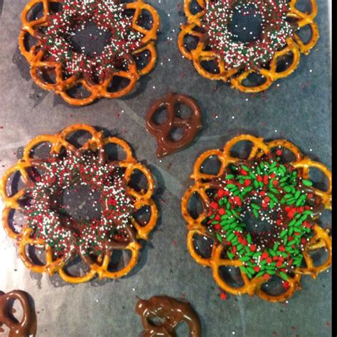 Pretzel wreaths. Dip the bottom edge in melted chocolate and around in ...