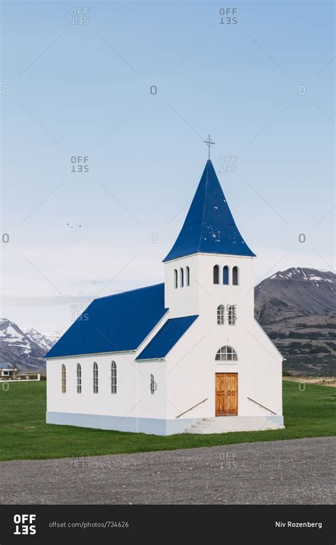 Blue and White church in Hofsos, north Iceland stock photo - OFFSET