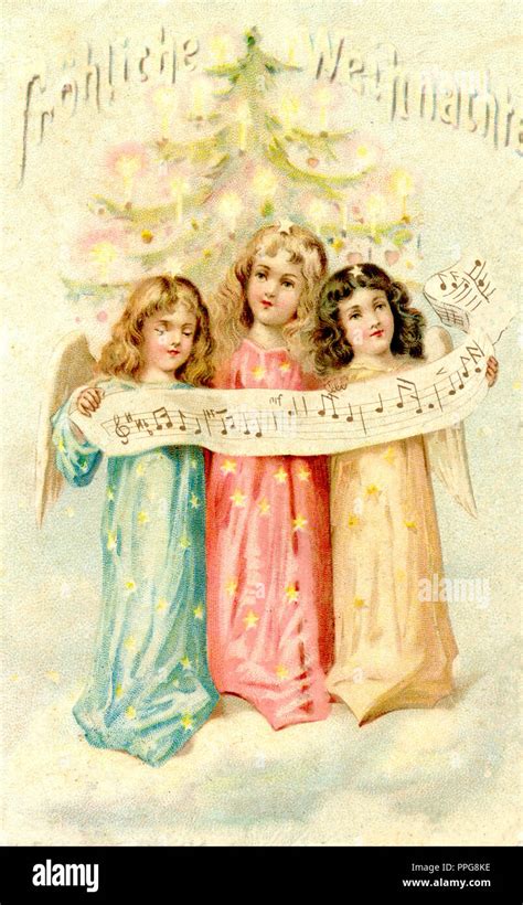 Three Christmas angels singing Stock Photo - Alamy