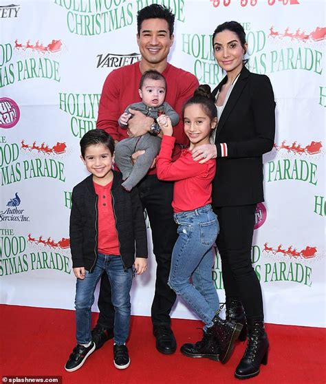 Mario Lopez serves as Grand Marshal at the Hollywood Christmas Parade alongside wife Courtney ...