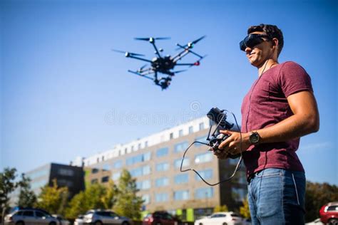 Handsome Young Man Flying a Drone Outdoors Stock Photo - Image of pilot, flight: 152120564