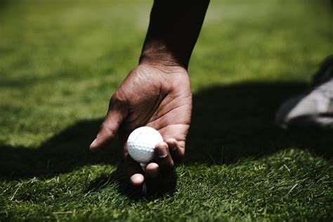 Person Holding Golf Ball · Free Stock Photo