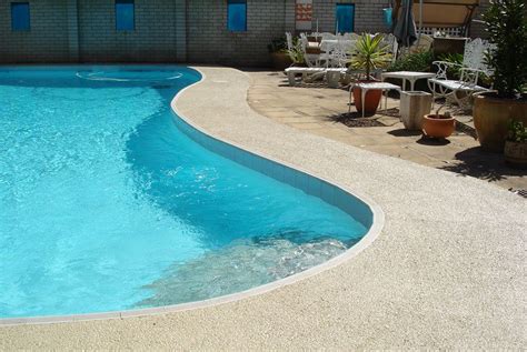 Newtown Domestic pool coping is painted with Luxapool Poolside and Paving in Merino colour ...