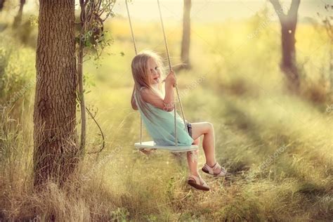 Girl on a swing Stock Photo by ©Alekuwka 69199005