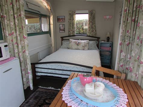 Vintage Retro Caravan awning interior includes a double bed - available to hire on-site at Cosy ...