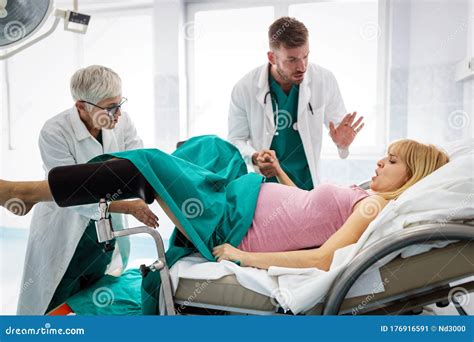 In the Hospital Woman in Labor Pushes To Give Birth, Obstetricians ...