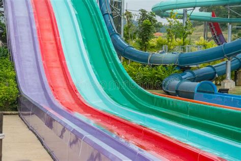 Colorful Plastic Water-slide in Swimming Pool Stock Image - Image of green, holiday: 103902367