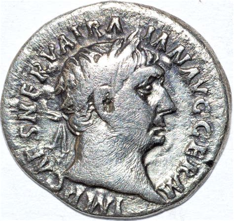 Roman Empire - TRAJAN (98-117). Denarius. Rome. Victory standing facing, head left, holding ...