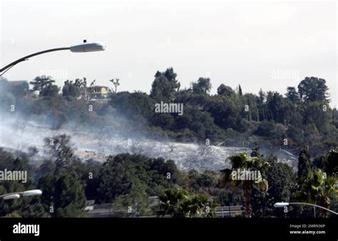 The famous Hollywood sign was in danger today as a fire raged on the ridge behind. Celebrity ...