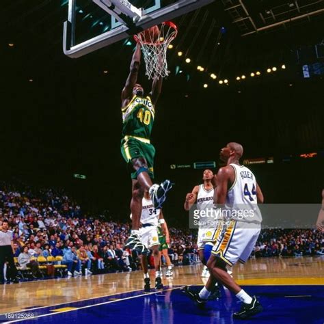 Shawn Kemp of the Seattle Supersonics dunks against the Golden State ...