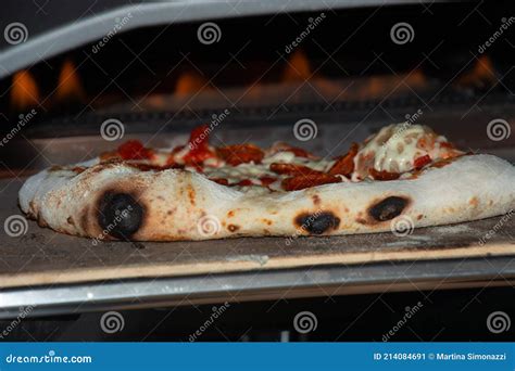 Burned Homemade Traditional Pizza in a Very Hot Pizza Oven Stock Image ...