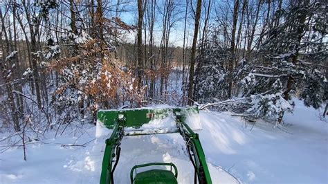 John Deere 1025R Plowing Snow - YouTube