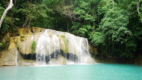 Erawan waterfall in the tropical rain forest Erawan National Park, Kanchanaburi, Thailand ...