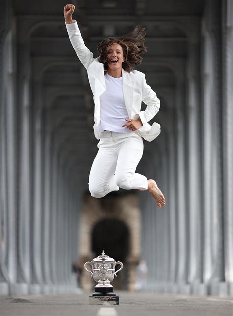 PIX: Swiatek brings along her trophy to Eiffel Tower! - Rediff Sports