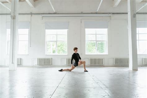 Ballet Dancer Stretching His Leg · Free Stock Photo