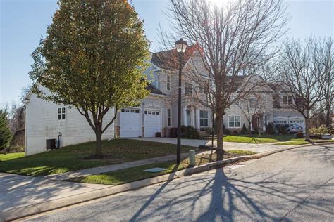 Two homes with trees in Pikesville, MD