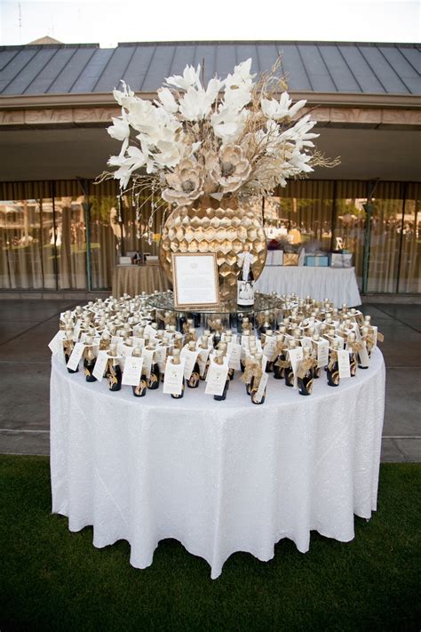 Favors & Gifts Photos - Champagne Favors Display - Inside Weddings