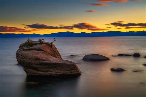 Premium Photo | Dramatic sunset over the bonsai rock of lake tahoe nevada