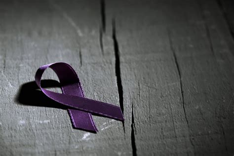 purple ribbon against the violence against women | Catalyst Center