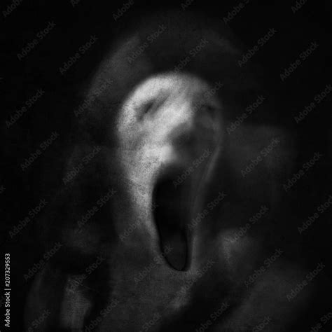 Scream of horror. Screaming ghost face. Scary halloween mask. Shot with ...