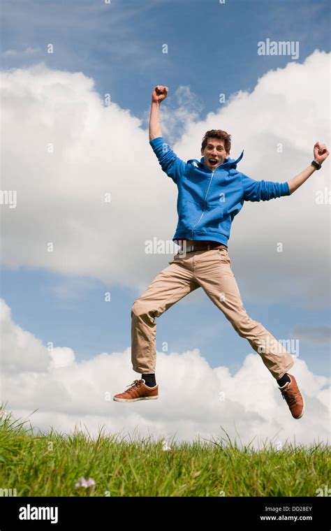 Happy jumping man Stock Photo - Alamy