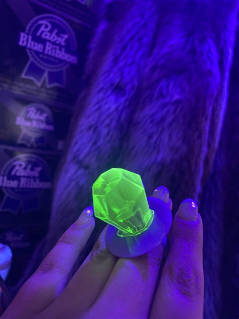 My watermelon flavored ring pop is UV reactive : r/mildlyinteresting