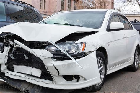 Front of white car get damaged by accident on the road 13427906 Stock Photo at Vecteezy